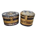 TWO ANTIQUE TOLEWARE TOP HAT TRAVELLING BOXES AND COVERS Decorated with panel of flowers enriched