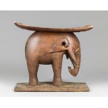A LATE 19TH/EARLY 20TH CENTURY CARVED ELEPHANT ASHANTI STOOL. Carved from a single piece of hardwood