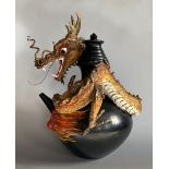 A LARGE AND UNUSUAL MID 20TH CENTURY DRAGON POT, JAVA, INDONESIA. (h 60cm x w 50cm x d 46cm)