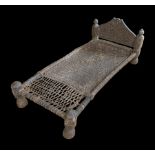 AN ANTIQUE CARVED LOW CHAIR OR BED FROM SWAT VALLEY IN AFGHANISTAN. (h 45cm x w 69cm x d 120cm)