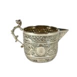 WAKELY & WHEELER, A VICTORIAN SILVER CREAM JUG, HALLMARKED LONDON, 1893 Having elaborate repousse