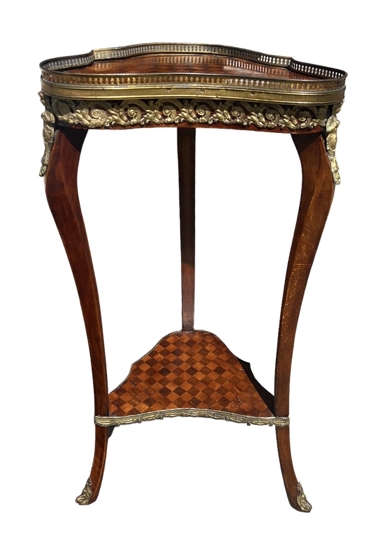A LOUIS XVI DESIGN FRUITWOOD AND GILT METAL MOUNTED TWO TIER OCCASIONAL TABLE. (h 81cm x d 28.5cm