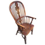 A 19TH CENTURY YEW WOOD AND ELM WINDSOR CHAIR The pierced splat and turned spindles above a solid
