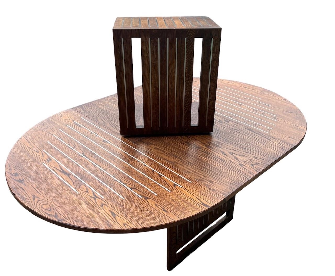 A CONTEMPORARY OAK AND STEEL INLAY DRAW LEAF DINING TABLE With single leaf, together with a matching - Image 7 of 7