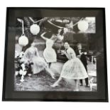 A DECORATIVE BLACK AND WHITE PRINT LADIES’ AND GENTLEMEN AT A GARDEN PARTY Framed and glazed. (124cm