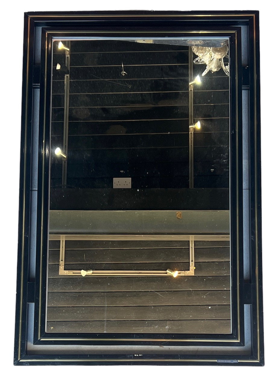 PIERRE VANDEL PARIS, A 1970s black lacquered and gilt mirror labelled to the frame 89.5cm x 60cm