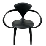 DESIGNED BY NORMAN CHERNER, AN EBONISED PLYWOOD ARMCHAIR Bearing label underneath. (h 80cm x d