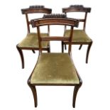 A SET OF THREE 19TH CENTURY REGENCY CARVED MAHOGANY BAR BACK CHAIRS With drop in seat, raised on