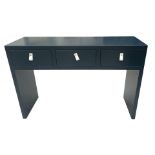 A CONTEMPORARY BLUE LACQUERED THREE DRAWER CONSOLE TABLE With white leather handles. (h 80cm x d