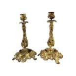 A PAIR OF LATE 19TH/EARLY 20TH CENTURY GILT ORMOLU BRONZE CANDLESTICKS Having grape and vine