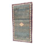 A VINTAGE PERSIAN GABBEH RUG With green ground and central diamond motif, surrounded stylise