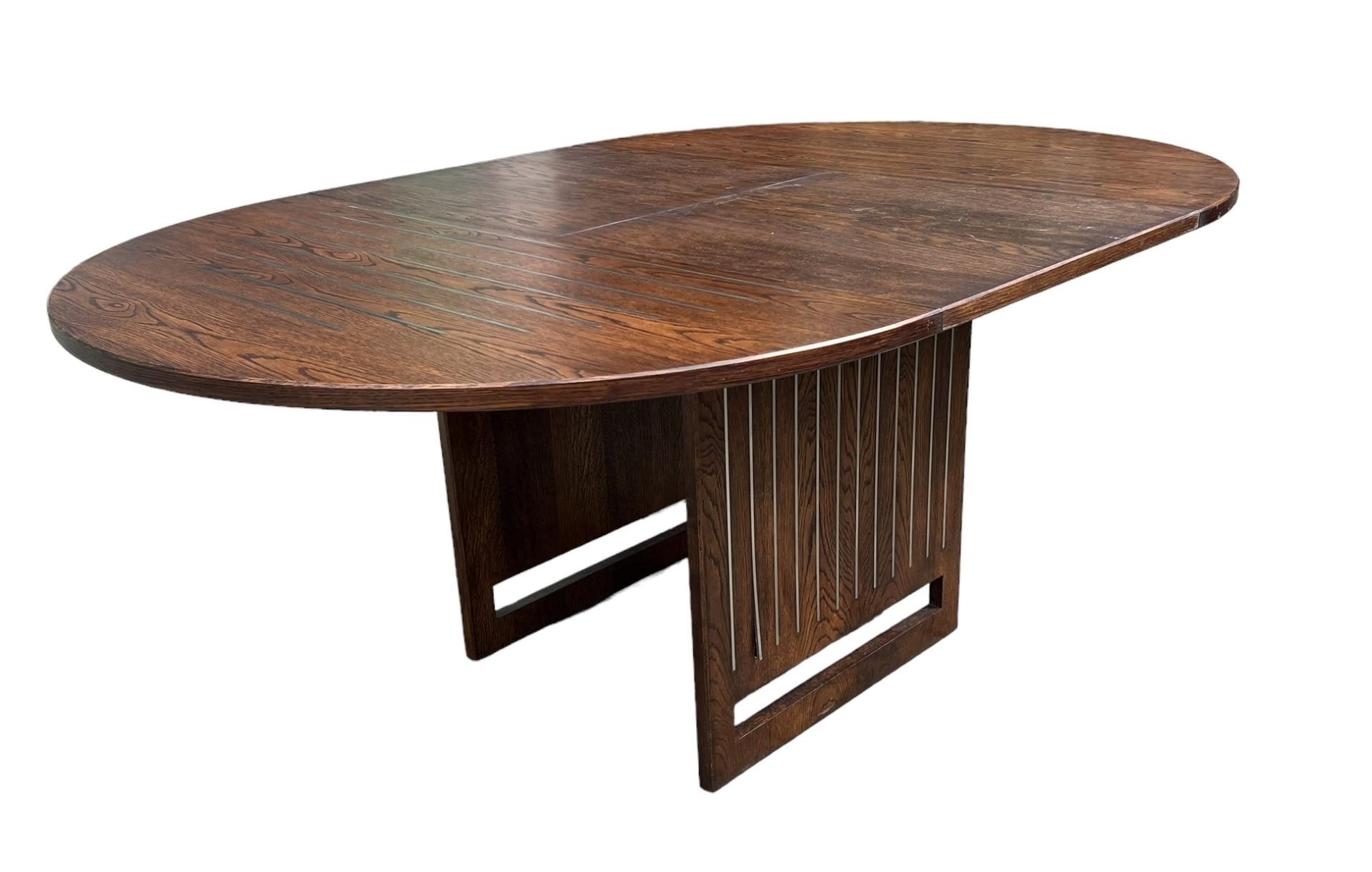 A CONTEMPORARY OAK AND STEEL INLAY DRAW LEAF DINING TABLE With single leaf, together with a matching - Image 4 of 7