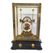 A GILT BRASS AND ENAMEL 'GRASSHOPPER' SKELETON CLOCK Having twin dials and pendulums, four glass