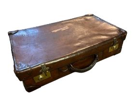 A VINTAGE STITCHED TAN LEATHER SUITCASE With brass locks. (60cm x 38cm x 16cm) Condition: good