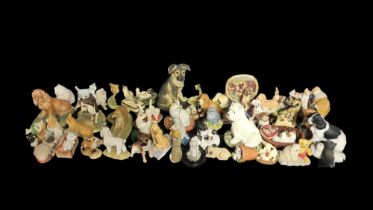 A LARGE COLLECTION OF 20TH CENTURY ANIMAL FIGURINES Cats and dogs in various designs, together