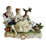 UNTER WEISS BACH, A VINTAGE GERMAN 'LACE' PORCELAIN GROUP FIGURINE Courting couple, the female