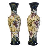 A PAIR OF MOORCROFT POTTERY VASES IN CHAMPERICO PATTERN DESIGNED BY SIAN LEEPER, CIRCA 2001 A pair