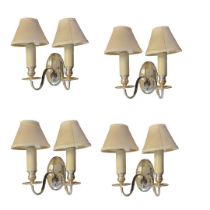 A SET OF FOUR VINTAGE SILVER PLATED TWIN BRANCH OVAL WALL SCONCES With ram head masks and twin