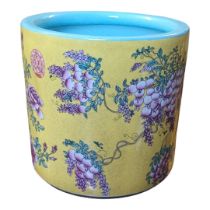 A CHINESE 20TH CENTURY STYLE ENAMELLED CYLINDRICAL CERAMIC BRUSH POT Colourfully decorated with
