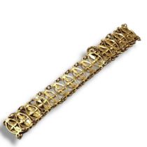 A HAM AND HUDDY 9CT GOLD GATE LINK BRACELET With delicate pierced openwork decoration, fully