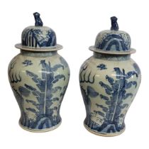 A PAIR OF CHINESE STYLE 20TH CENTURY BLUE AND WHITE CERAMIC GINGER JARS Painted with floral motifs
