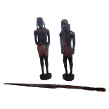 A PAIR OF LATE 20TH CENTURY TRIBAL AFRICAN HARDWOOD CARVINGS OF FIGURES Wearing regional costume (