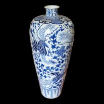 A LARGE 20TH CENTURY CHINESE BLUE AND WHITE VASE Decorated with dragons and flora. (diameter 38cm