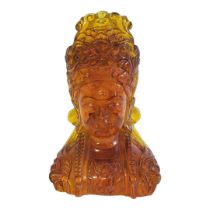 A RED AMBERINE BUST OF THE GODDESS GUANYIN. (w 12cm x d 9cm x h 18cm) Condition: good overall