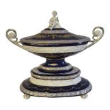 A LARGE CONTINENTAL PORCELAIN TWIN HANDLED TUREEN, COVER AND STAND Having a bisque porcelain