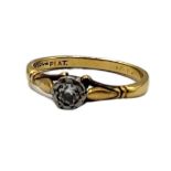 A VINTAGE 18CT GOLD AND DIAMOND SOLITAIRE RING The single round could diamond in an illusion set