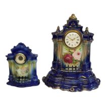 AN EARLY 20TH CENTURY POTTERY CASED CLOCK ON STAND With floral decoration on a gilt a blue ground,