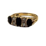 A VINTAGE 9CT GOLD AND SAPPHIRE THREE STONE RING The oval cut graduated stones interspersed with