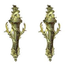 A PAIR OF LARGE CONTINENTAL GILT BRONZE WALL SCONCES With pierced foliage backs supporting single