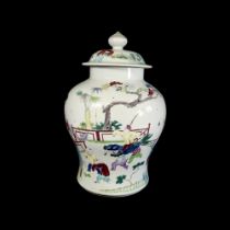A 19TH/20TH CENTURY CHINESE JAR AND COVER Decorated with young boys and maidens playing in a