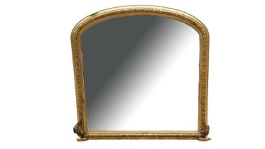 A 19TH CENTURY STYLE GILT FRAMED OVERMANTLE MIRROR The vine and berry moulded arched frame centred