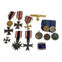 A COLLECTION OF EARLY 20TH CENTURY GERMAN MILITARY MEDALS AND BADGES To include an iron cross badge,