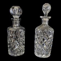 TWO VINTAGE CUT GLASS DECANTERS Having ball form stoppers and cuts to body, together with a Japanese