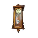 A 19TH CENTURY MAHOGANY VIENNA WALL HANGING CLOCK With white enamelled dial, pendulum and