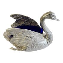 A SILVER PLATED SAUCE BOAT IN THE FORM OF A SWAN With blue glass liner. (w 9cm x d 21cm x h 15cm)