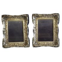 A PAIR OF 20TH CENTURY BRITANNIA SILVER PHOTOGRAPH FRAMES Rectangular form with fine scrolled