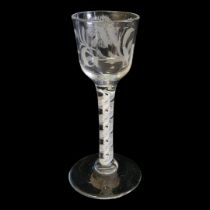 AN 18TH CENTURY AIR TWIST LIQUOR GLASS Having engraved floral decoration to bowl, initials ‘W.G.M.’,