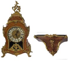 LAURIS, A 20TH CENTURY WALNUT AND GILT BRASS BRACKET CLOCK Having a pierced brass scrolled finial