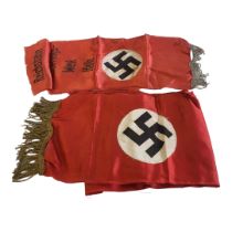 TWO WWII GERMAN MILITARY SILK BANNERS Each having a Swastika on red ground, one marked '