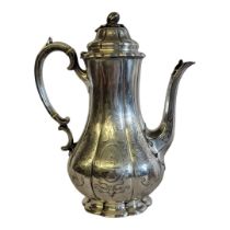 A VICTORIAN SILVER COFFEE POT Having a melon form finial,flutes to body and engraved decoration,