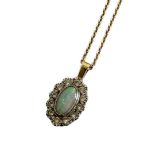 AN 18CT GOLD, OPAL AND DIAMOND PENDANT NECKLACE The cabochon cut opal edged with round cut
