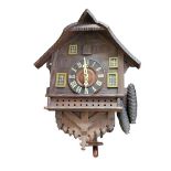 A LATE 19TH SWISS PINE CASED 30 HOUR CUCKOO CLOCK With weights and pendulum, along with a smaller