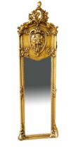 A CONTINENTAL GILT FRAMED MIRROR With foliage cartouche above a lion mask and bevelled plate. (