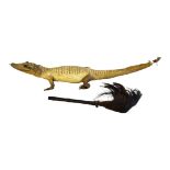 A VINTAGE TAXIDERMY ALLIGATOR Having glass marble set eyeballs, together with an animal hair and