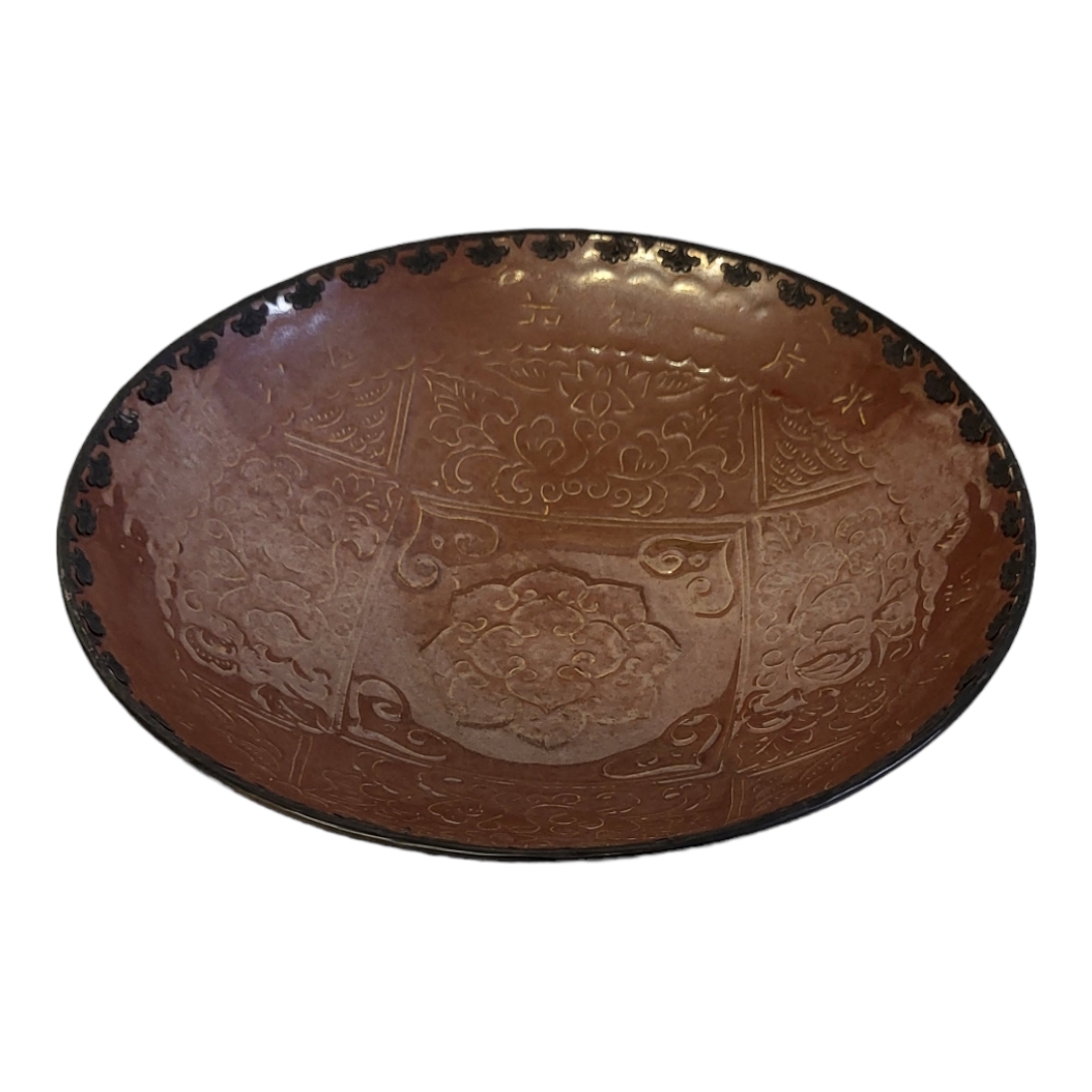 A CHINESE WHITE METAL AND TERRACOTTA CEREMONIAL BOWL With applied metal rim, embossed decoration and