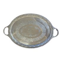 A LARGE VICTORIQN SILVER TWIN HANDLED OVAL BUTLER'S TRAY With embossed border and fine engraved